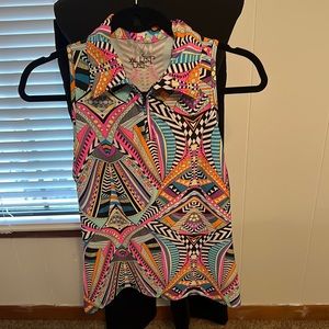 TZU TZU sleeveless golf Shirt.